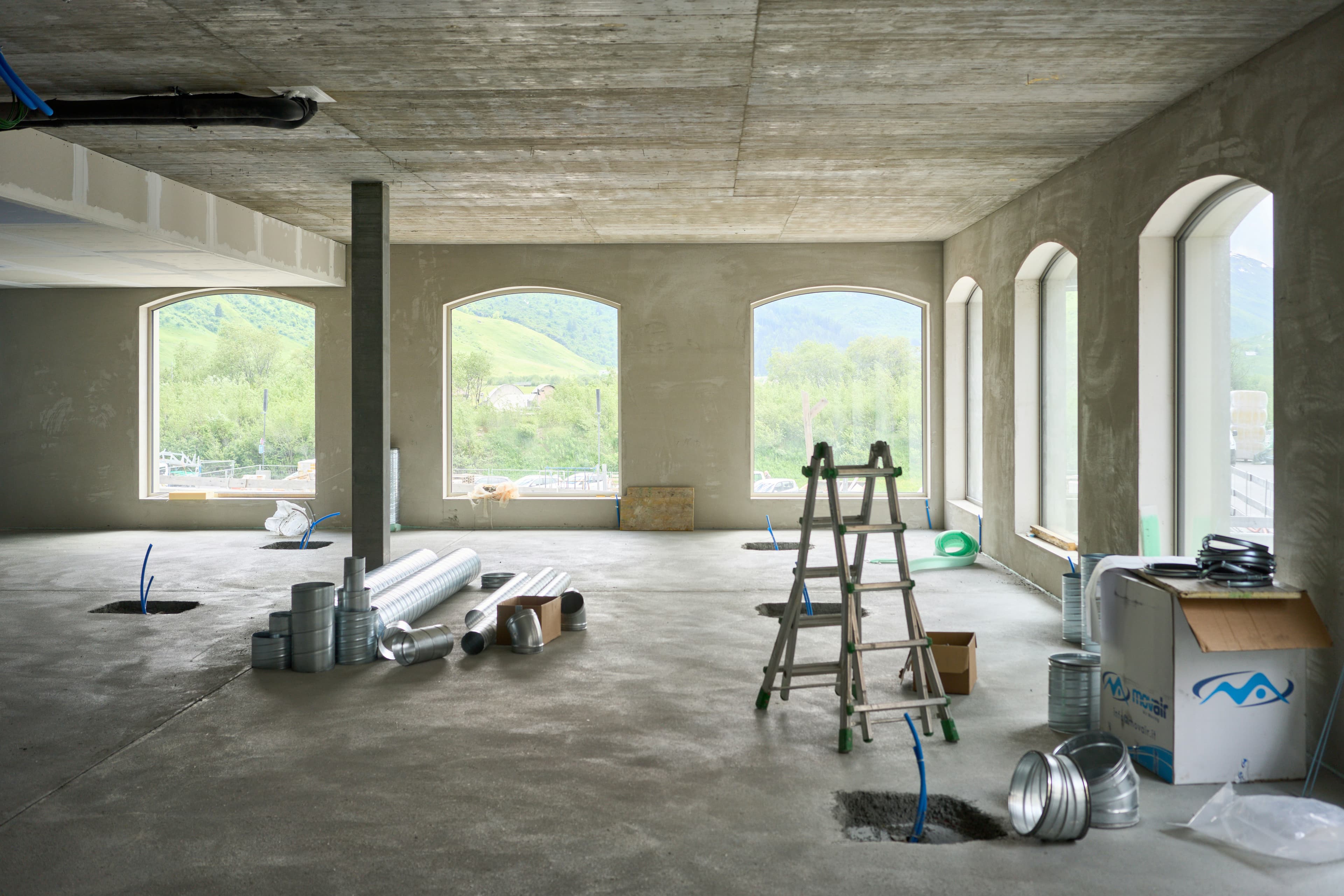 Architectural concrete shell building with arched windows